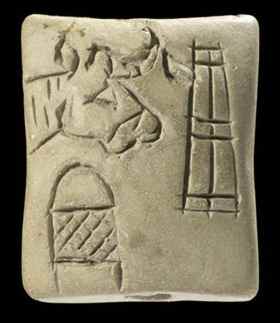 Sumerian clay 'tag' inscribed with ideographic symbols.
