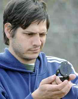 JASON VORHEES/THE TELEGRAPH Macon, Georgia 12/05/2010: Archeologist Daniel Bigman looks at a compass while lining up a grid at the Ocmulgee National Monument Sunday. JASON VORHEES/THE TELEGRAPH Macon, Georgia 12/05/2010: Archeologist Daniel Bigman looks at a compass while lining up a grid at the Ocmulgee National Monument Sunday.