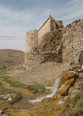 The ramparts of Takht-e Soleiman, with the outflow from the crater lake in the foreground. Photo: Jill Worrall 