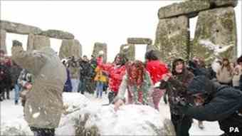 Snow and ice failed to stop people visiting Stonehenge to watch the sunrise on the winter solstice.