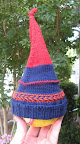 this is a "recipe hat" I made from some scrap yarn plus some Berroco Comfort yarn I had lying around. recipe meaning I had no pattern, just played around until it was baby-head sized.