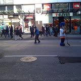 Blue vest guy was dancing the to music in his head in the middle of the street. Rock on, sir.