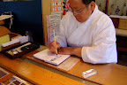 He is signing our temple book...