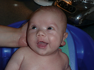 Smiling at Daddy. He's doing a good job.