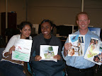 Stacey Villegas and Lucy Taruki make collages for their advisor, Neil Harrington