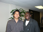 Advisor Mike Chen and Jonathon McNair smile for the camera after one of their volunteer advisor meetings
