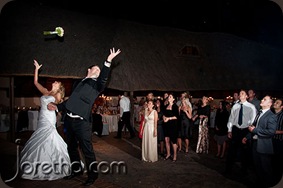 Bride and groom throwing garter and bouquet - Joretha Taljaard Wedding Photography