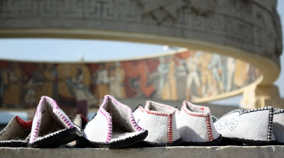 Traditional shoes in front of a Soviet war monument in Ulaanbaatar Mongolia
