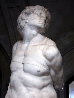 Michelangelo's The Slave on a private tour of the Louvre museum in Paris France