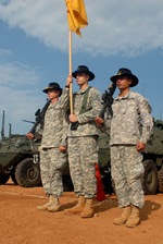 Squadron color guard members, Sgt. David Wolfe, Spc. David Swan and Cpl. Arthur Fread, all from the 2nd Squadron, 14th Cavalry Regiment “Strykehorse,” 2nd Stryker Brigade Combat Team, 25th Infantry Division, from Schofield Barracks, Hawaii, stand at attention during the opening ceremony of Exercise Yudh Abhyas 09 at the Babina Indian army base, Oct. 12. YA09 is a bilateral exercise involving the armies of India and the United States. 