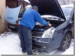 A builder takes time out from his busy tea drinking to try and get the Renault started