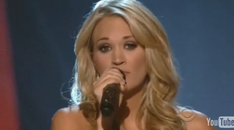 picture of carrie underwood in red dress on 2009 ACMs singing