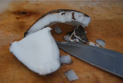 Skinning the coconut meat