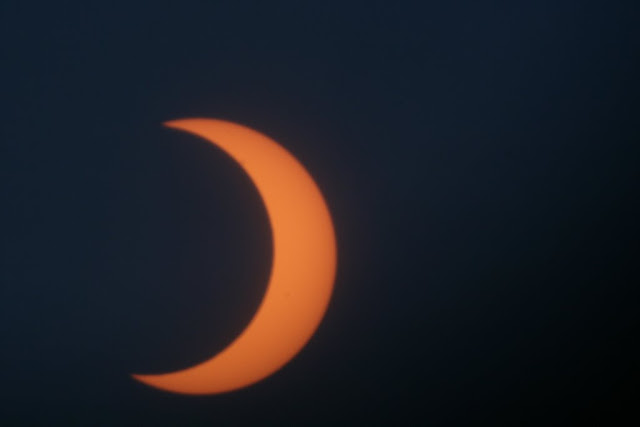 Partial phase post annularity. Moon uncovers sunspot AR11040