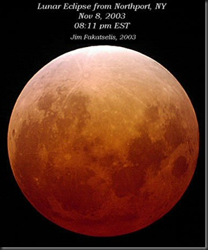 A similar lunar eclipse in Nov. 2003. The Moon may appear coppery red. Credit: Jim Fakatselis.