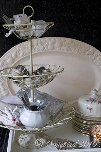 Three tired basket with kitchen accessories3