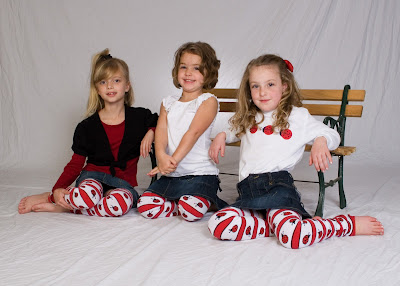 girls in ladybugs baby leg warmers