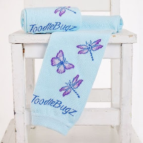 dragonflies and butterflies on baby girl legs