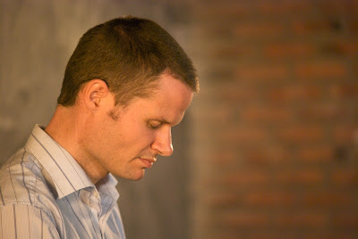 Bruce Rossington praying before class