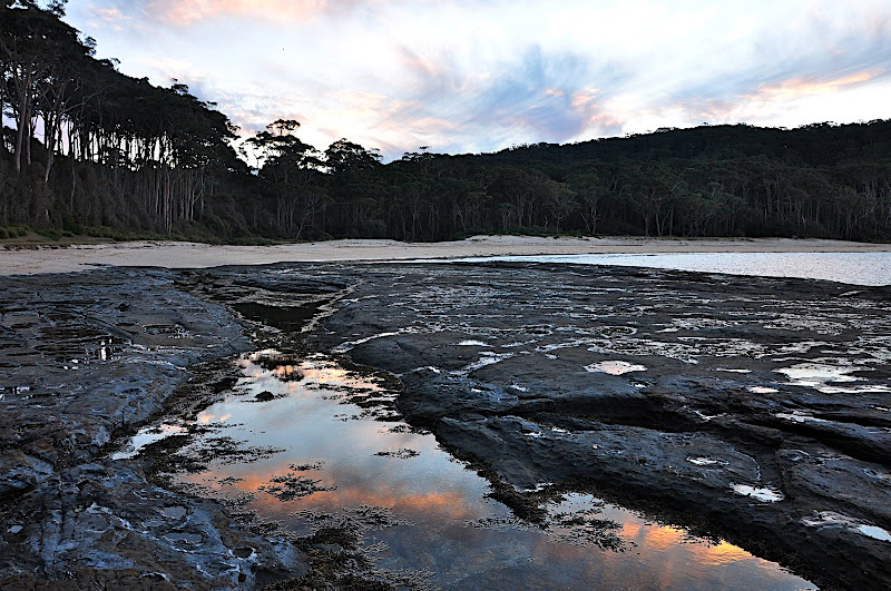 sunset reflected in tidal pool