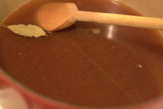 picture of stock and spices added to dutch oven