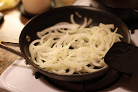 picture of raw onions in saute pan