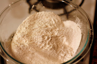 In a separate bowl, sift together flour, baking powder, baking soda, and salt