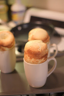 picture of freshly baked popovers in coffee cups