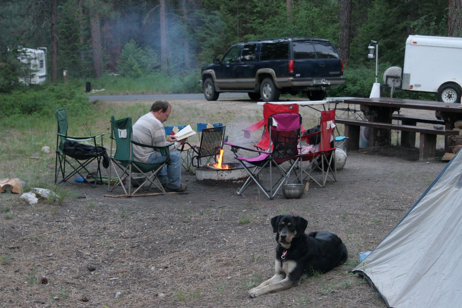 [Ken reading by campfire[2].jpg]