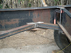 We added diagonal supports with scrap angle iron all through the trailer. We started centered on the axles and worked forward and then back.