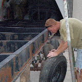 Installing the trailer wheels. These mobile home tires are 14 ply tires and can take 3,000 lbs per tire. They typically only last about 10,000 miles, but they shouldn't blow out, they'll throw rubber and go flat. The are 'rimless' tires with bolts that hold the rim onto the axle.