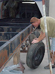 Installing the trailer wheels. These mobile home tires are 14 ply tires and can take 3,000 lbs per tire. They typically only last about 10,000 miles, but they shouldn't blow out, they'll throw rubber and go flat. The are 'rimless' tires with bolts that hold the rim onto the axle.