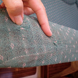 The salon sofa shows wear and tear.