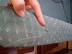 The salon sofa shows wear and tear.