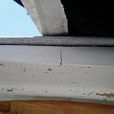 The fiberglass section in the cockpit that extends out about a foot shows some cracks from bearing the weight of the mast when the topping lift is loose. A block a little farther forward would eliminate this problem.
