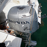The honda 3 stroke outboard on a sled that lifts out of the water.