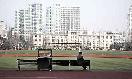A tyro uses a computer on the campus of the Shanghai Jiaotong University in Shanghai