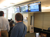 Global Media Outreach.  The center screen displays Google Earth jumping in real time from location to location of email submissions to their evangelistic websites.