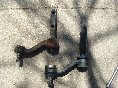 There we go!  Old one off.  New one ready to go.  Very happy to see Made in the USA stamped on the new one.  This one is a good bit heavier too.  The old one you could grab the bracket and twirl the arm around like a noise maker.  The new one is a lot more sturdy and should fix the main problem of wobbly steering.