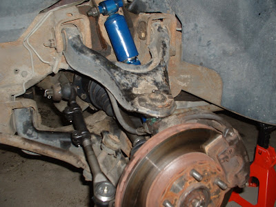From this point on I kinda stopped taking pictures.  But here you can see the finished drivers side.  New tie rod, new drive axle, and a new shock absorber.  I have to do the same thing to the other side, so Ill get pictures of the drive axle and shock installation tomorrow.