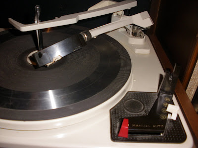 The tone arm is bent, but I think its fixable.