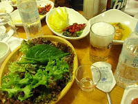 More extras.  You basically use the lettuce leaves like tortillas and wrap up the meat and sauces.