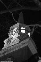 Someone Up There: At night this tower on Christ Church in Philadelphia takes on a whole different feeling; one wonders 'who is really up there?' and 'are they flesh and blood or spectre?' (1/100 sec @ f/1.8; 50mm) Copyright 2009, Kerri Shotts