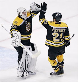 Andrew Ference congratulates Tim Thomas on his shutout against the Devils