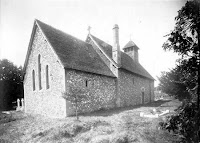 St Mary's Church. The church exterior from the north-east showing the flint-faced chancel and nave and timber bell turret, as well as some Norman survivals such as windows. Copyright © Oxfordshire County Council Photographic Archive. Reproduced with the kind permission of Oxfordshire Studies. This photograph may be purchased from their Heritage Search web site at http://www.oxfordshire.gov.uk/heritagesearch