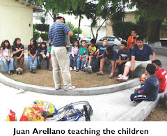 Juan Arellano teaching the children
