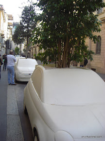 Giant car-shaped plant pots, Milan