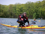 Shawna Franklin demonstrating her balance and agility by paddling her sea kayak from the backdeck.
