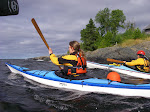 Paddling out of the river mouth with the crew, my superior carbon fiber paddle is just visible in the upper left.