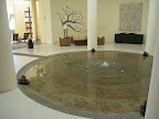 Shallow water fountain in the middle of the lobby. I bet people walk into it by mistake.